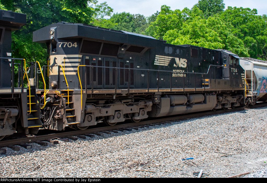 NS 7704 trails on a southbound manifest 